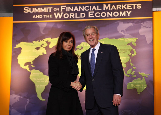 President George W. Bush welcomes Argentina President Cristina Fernandez de Kirchner to the Summit on Financial Markets and the World Economy Saturday, Nov. 15, 2008, at the National Building Museum in Washington, D.C. White House photo by Chris Greenberg