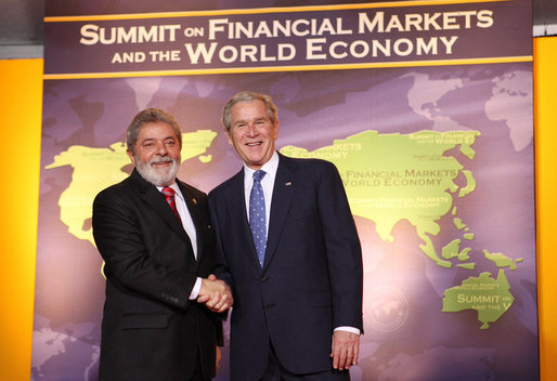 President George W. Bush welcomes the Brazil's President Luiz Inacio Lula da Silva to the Summit on Financial Markets and the World Economy Saturday, Nov. 15, 2008, at the National Building Museum in Washington, D.C. White House photo by Chris Greenberg