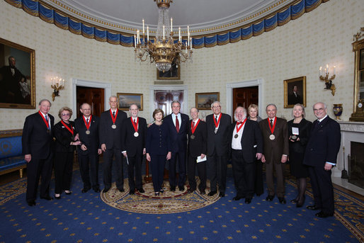 President George W. Bush and Mrs. Laura Bush stand with the recipients of the 2008 National Humanities Medal in the Blue Room at the White House Monday, Nov., 17, 2008. Pictured from left, Thomas A. Saunders III, president, and Jordan Horner Saunders, Board of Directors, North Shore Long Island Jewish Health Systems; Albert Marrin, author; Richard Brookhiser, Senior Editor, National Review; Harold Holzer, Senior Vice President for External Affairs, Metropolitan Museum of Art; Gabor S. Boritt, Director, Civil War Institute, Gettysburg College; Milton J. Rosenberg, WGN Radio Chicago; Myron Magnet, editor, City Journal; Adair Wakefield Margo, Presidential Citizen Medal recipient; Robert H. Smith, president, Vornado/Charles E. Smith; Laurie Norton, Director and CEO, Norman Rockwell Museum; Bruce Cole, Presidential Citizen Medal recipient. White House photo by Chris Greenberg