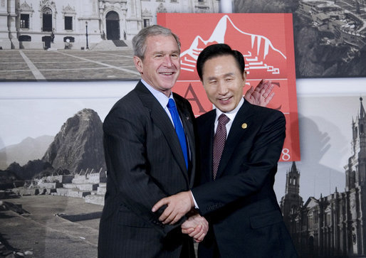 President George W. Bush and President Lee Myung-bak of the Republic of Korea pause for photographers Saturday, Nov. 22, 2008, prior to their meeting in Lima, Peru, site of the 2008 APEC Summit. White House photo by Eric Draper