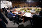 President George W. Bush relaxes in his chair during the afternoon leaders retreat Saturday, Nov. 22, 2008, at the APEC Summit in Lima, Peru. White House photo by Eric Draper