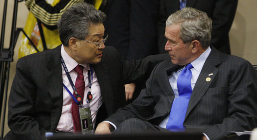 President George W. Bush talks with Spencer Kim, Chairman of CBOL Corporation and U.S. representative to the APEC Business Advisory Council, during a dialogue with ABAC leaders Saturday, Nov. 22, 2008, in Lima, Peru. White House photo by Eric Draper