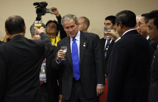 President George W. Bush lifts his glass during a toast given Saturday, Nov. 22, 2008, by Peru's President Alan Garcia during the Leaders Dialogue with APEC Business Advisory Council at the Ministry of Defense Convention Center in Lima, Peru. White House photo by Eric Draper