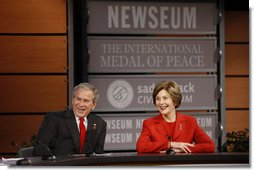 President George W. Bush and Mrs. Laura Bush react during a question and answer session Monday, Dec. 1, 2008, at the Saddleback Civil Forum on Global Health at the Newseum in Washington, D.C. White House photo by Eric Draper