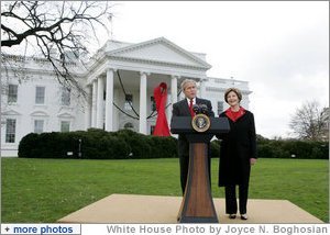 President George W. Bush and Mrs. Laura Bush address reporters on World AIDS Day