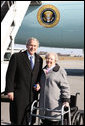 President George W. Bush poses with Donna Turner, a USA Freedom Corps Service recognition recipient honored by President Bush for her volunteer service, Tuesday, Dec. 2, 2008, on arrival at the Piedmont Triad International Airport in Greensboro, N.C. White House photo by Chris Greenberg