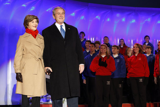 President George W. Bush and Mrs. Laura Bush join the Enterprise High School Encores from Enterprise, Ala., on stage at the Ellipse Thursday, Dec. 4, 2008, during the Lighting of the National Christmas Tree in Washington, D.C. White House photo by Eric Draper