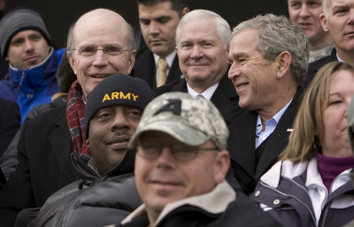 President George W. Bush sits among U.S. Army troops wounded while serving in Iraq and Afghanistan as they cheer for the Black Knights of West Point during the first half of the 2008 Army Navy game at Lincoln Financial Field in Philadelphia. White House photo by Eric Draper
