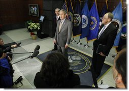 President George W. Bush delivers remarks during his visit to the National Counterterrorism Center Monday, Dec. 8, 2008, in McLean, VA. President Bush is joined by Counterterrorism Director Mike Leiter, left, and National Intelligence Director Mike McConnell. White House photo by Eric Draper