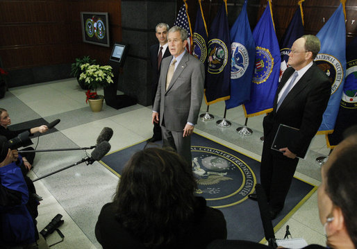 President George W. Bush delivers remarks during his visit to the National Counterterrorism Center Monday, Dec. 8, 2008, in McLean, VA. President Bush is joined by Counterterrorism Director Mike Leiter, left, and National Intelligence Director Mike McConnell. White House photo by Eric Draper