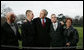 President George W. Bush pauses to greet Marine Lance Cpl. Patrick Paul Pittman Jr., left, and Lance Cpl. Marc E. Olson, both wounded in Operation Iraqi Freedom, as he arrived on the South Lawn of the White House Tuesday, Dec. 9, 2008, after spending the day at West Point. With them are Patrick Paul Pittman Sr., father of Lance Cpl. Pittman, and Janice Kloski, mother of Lance Cpl. Olson. White House photo by Joyce N. Boghosian