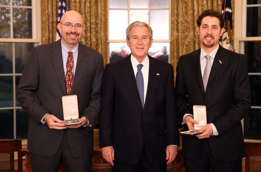 President George W. Bush stands with Mike Feinberg and Dave Levin after presenting them with the 2008 Presidential Citizens Medal Wednesday, Dec. 10, 2008, in the Oval Office of the White House. White House photo by Chris Greenberg