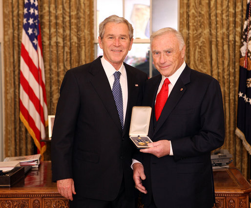 President George W. Bush stands with Arnold Fisher after presenting him with the 2008 Presidential Citizens Medal Wednesday, Dec. 10, 2008, in the Oval Office of the White House. White House photo by Chris Greenberg