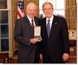 President George W. Bush stands with Sam Heyman after presenting him with the 2008 Presidential Citizens Medal Wednesday, Dec. 10, 2008, in the Oval Office of the White House. White House photo by Chris Greenberg