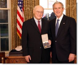 President George W. Bush stands with Andrew Marshall after presenting him with the 2008 Presidential Citizens Medal Wednesday, Dec. 10, 2008, in the Oval Office of the White House. White House photo by Chris Greenberg