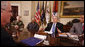 President George W. Bush speaks to participants during a meeting on drug use reduction Thursday, Dec. 11, 2008, in the Roosevelt Room of the White House. Listening in are, from left: Lt. Mike Boudreaux, Narcotics Commander, Tulare County Sheriff's Department, Visalia, Calif.; Janice Dessaso Gordon, co-founder, Community Action Group, Washington, D.C., and Josh Hamilton, outfielder with the Texas Rangers. John Walters, Director of the Office of National Drug Control Policy, is in foreground at left. White House photo by Chris Greenberg
