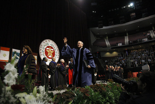 President George W. Bush waves as he leaves the stage following his commencement address at Texas A&M University's winter convocation Friday, Dec. 12, 2008, in College Station, Texas. White House photo by Eric Draper