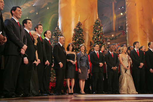 Mrs. Laura Bush joins Dr. Phil McGraw and his wife Robin, center-left, along with stage performers Sunday, Dec. 14, 2008, during the annual Christmas in Washington performance at the National Building Museum in Washington D.C. White House photo by Joyce N. Boghosian