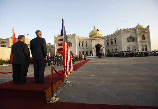 President George W. Bush stands with Iraq's President Jalal Talabani during a welcoming ceremony Sunday, Dec. 14. 2008, to the Salam Palace in Baghdad, where President Bush met with Iraq's leadership. White House photo by Eric Draper