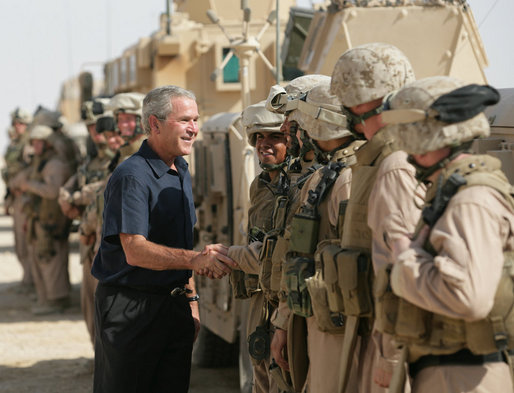 President George W. Bush visits with U.S. troops upon his arrival Sept. 3, 2007, in Al Anbar Province, Iraq. White House photo by Eric Draper