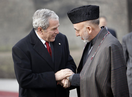 President George W. Bush bids farewell to President Hamid Karzai of Afghanistan as he prepares to depart the presidential palace Monday, Dec. 15, 2008, in Kabul. White House photo by Eric Draper
