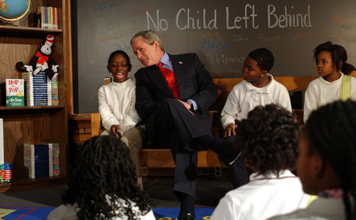 President George W. Bush talks to fourth-graders during a visit January 5, 2004, to the Pierre Laclede Elementary School in St. Louis. White House photo by Tina Hager