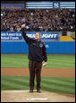 President George W. Bush gives a thumbs-up as he stands on the mound at Yankee Stadium Oct. 30, 2001, before throwing out the ceremonial first pitch in Game Three of the World Series between the Arizona Diamondbacks and the New York Yankees. White House photo by Eric Draper