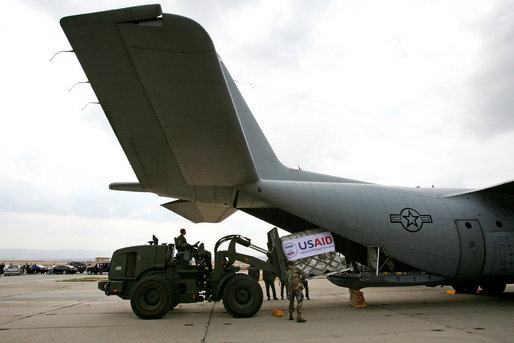 A U.S. Army crew offloads USAID humanitarian supplies from a C-130 aircraft Thursday, Sept. 4, 2008 during a visit by Vice President Dick Cheney to a U.S. relief operation center at Tbilisi International Airport, Georgia. Through U.S. relief efforts, Georgians affected by the recent Russian aggression are receiving cots, blankets, food rations and hygiene packs. White House photo by David Bohrer