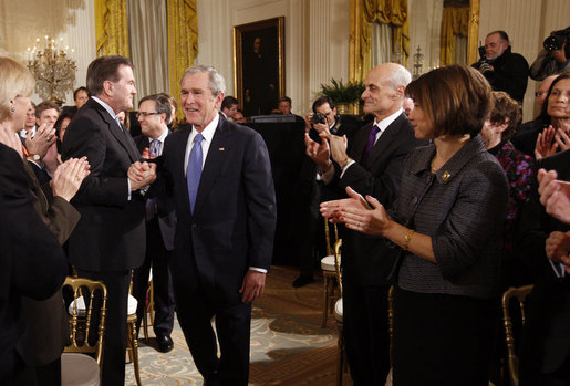 President George W. Bush grasps hands with Former Homeland Security Advisor, Tom Ridge, as he receives applause following his address to the nation Thursday evening, Jan. 15, 2009, from the East Room of the White House. White House photo by Eric Draper