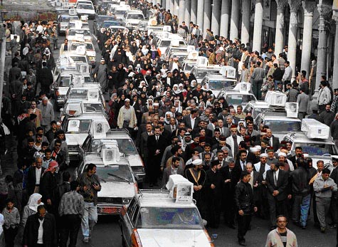 Photo of a government-organized baby-funeral procession in Baghdad, 1998.
