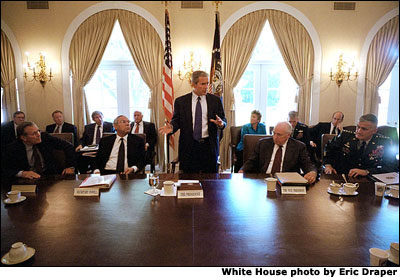 Meeting with his National Security Council in the Cabinet Room the morning after the attacks in New York City and Washington, D.C., President Bush outlines the new course of his administration. White House Photo by Eric Draper.