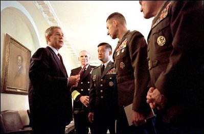 President George W. Bush meets with members of the Joint Chiefs of Staff in the Cabinet Room Oct. 24, 2001. Pictured, from left, are Admiral William J. Fallon, Vice Chairman for Naval Operations; General Eric Shinseki, Chief of Staff of the United States Army; General Peter Pace, Vice Chairman of the United States Marine Corps; and General Michael J. Williams, Assistant Commandant of the United States Marine Corps.