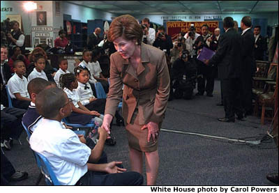 Laura Bush shakes hands with a student. White House photo by Carol Powers.