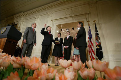 President George W. Bush, left, looks on during the swearing-in ceremony for U.S. Supreme Court Justice Samuel A. Alito, Tuesday, Feb. 1, 2006 in the East Room of the White House, sworn-in by U.S. Supreme Court Chief Justice John Roberts. Altio's wife, Martha-Ann, their son Phil and daughter, Laura, are seen center-background.
