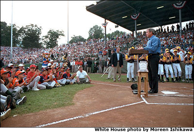 President Bush kicks off the Little League World Series with a round of big hand shakes and thank you's. "You prioritize your family and that's crucial for a healthy world, to make sure our families remain strong," said the President during his induction ceremony into Little League's Hall of Excellence Aug. 26 in Williamsport, Pa. "I equate Little League baseball with good families." White House photo by Moreen Ishikawa.