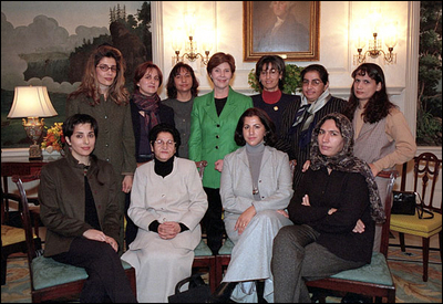 Eleven Afghan women join Laura Bush at a meeting at the White House on November 28. The women fled their country when the Taliban came to power.