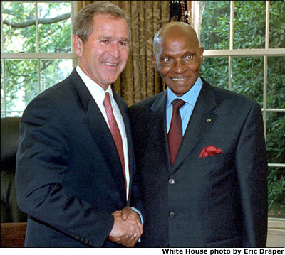 President Bush greets President Abdoulaye Wade of Senegal in the Oval Office June 28, 2001. White House photo by Eric Draper.