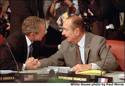 President Bush and President Chirac of France talk over issues during the G-8 sessions. White House photo by Paul Morse.