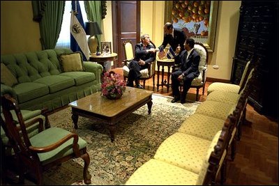 President George W. Bush and El Salvadorian President Francisco Flores talk privately during their bilateral meeting in San Salvador, El Salvador, Sunday, March 24, 2002. White House photo by Eric Draper