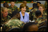 Laura Bush talks with members of the 101st Airborne at Fort Campbell, Kentucky. Known as "The Screaming Eagles," this airborne division took part in the largest airborne assault of World War II and also served in Vietnam and more recently in the Balkans.