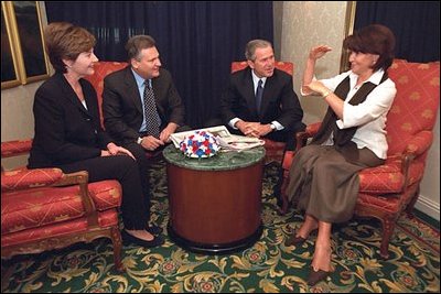 The two Presidents and their wives share a few private moments during a long day of public activities.