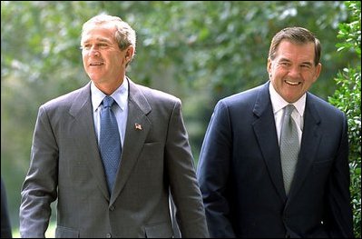President Bush and Governor Ridge walk together on the South Lawn of the White House Sept. 19, 2002.
