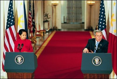 Philippine President Gloria Macapagal-Arroyo and President George W. Bush hold a joint press conference in the East Room Monday, May 19, 2003. "The Philippines and the United States are strong allies in the war on terror," said the President. "The murder of citizens from both our countries last week in Saudi Arabia reminds us that this war is far from over."