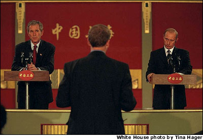  Presidents Bush and Putin hold a joint press conference during the APEC economic summit in Shanghai, China, Oct. 21. In the hours following the attacks, President Putin called President Bush and said that a moment of silence for America would be held throughout Russia, and that all flags should be lowered to half-staff, said White House Press Secretary Ari Fleischer. WHITE HOUSE PHOTO BY TINA HAGER. 