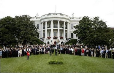 President George W. Bush, Mrs. Bush, Vice President Dick Cheney and Mrs. Cheney, center, are joined by White House staff and families of victims of 911 for a Moment of Silence on the South Lawn at 8:46am, Saturday, Sept. 11, 2004.