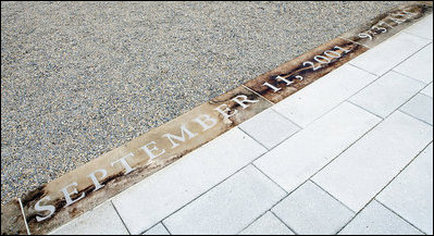 The date and time of September 11, 2001 9:37 AM is seen etched in the entry walkway to the 9/11 Pentagon Memorial Thursday, Sept. 11, 2008 at the Pentagon in Arlington, Va., where 184 memorial benches were unveiled honoring all innocent life lost when American Airlines Flight 77 crashed into the Pentagon.
