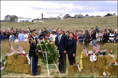 President George W. Bush and Mrs. Laura Bush participate in a wreath-laying ceremony near the site of the crash where seven crew members and 33 passengers died when the plane crashed in Somerset County. Officials believe the plane was heading for a target in Washington, D.C., when the passengers fought back against the four hijackers.