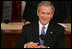President George W. Bush smiles as he's applauded during Tuesday's 2006 State of the Union address.