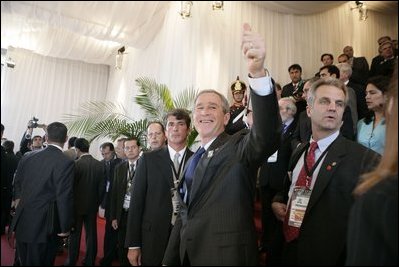 President George W. Bush gives the thumbs-up to well-wishers Friday, Nov. 4, 2005, as he attended the opening ceremonies of the 2005 Summit of the Americas at the Teatro Auditorium in Mar del Plata, Argentina.