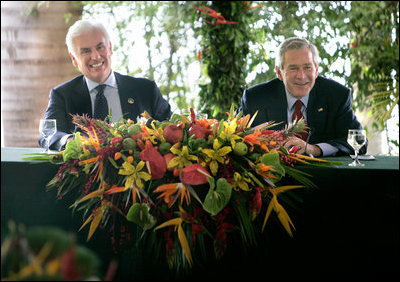 President George W. Bush enjoys a light moment with U.S. Ambassador to Brazil John Danilovich during a roundtable discussion with young leaders from Brazil, Sunday, Nov. 6, 2005 in Brasilia, Brazil. 
